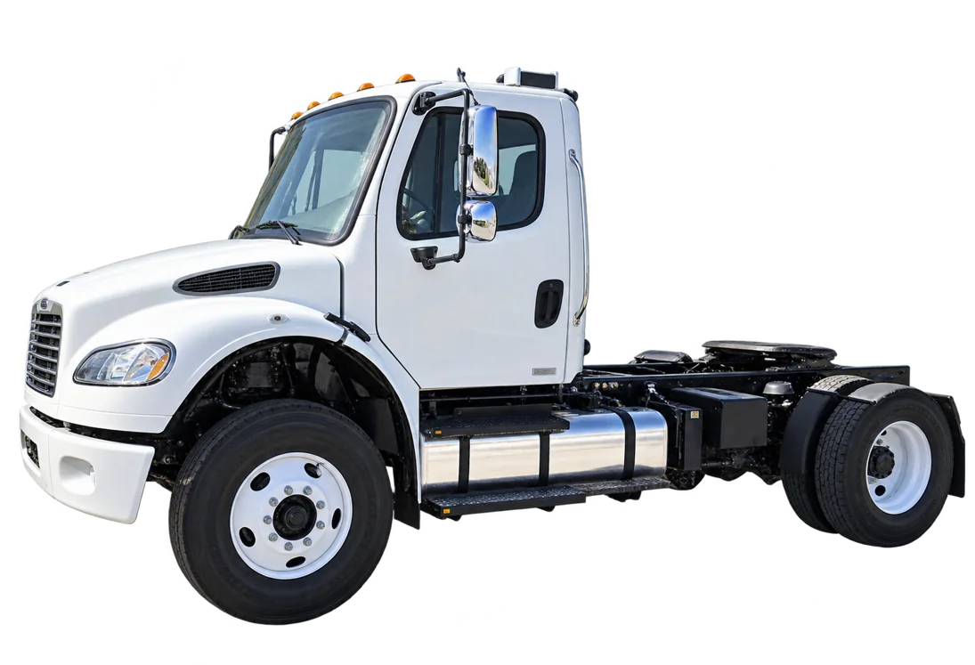 White Freightliner day-cab commercial truck